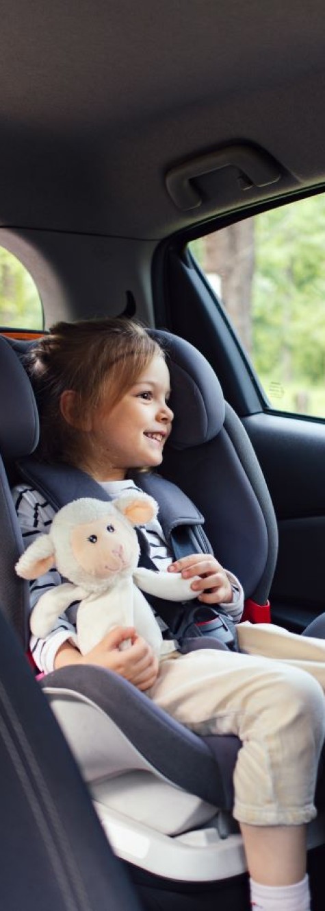 little girl in car seat