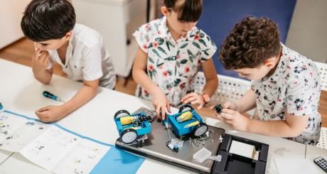 children putting together remote control car