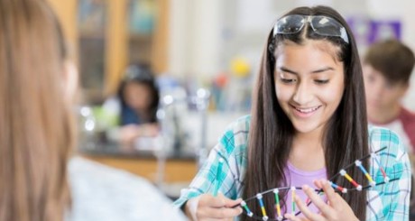 student holding dna model